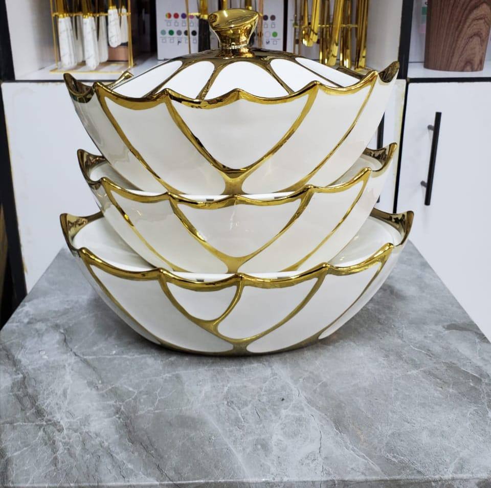 Ceramic serving bowl with gold rim