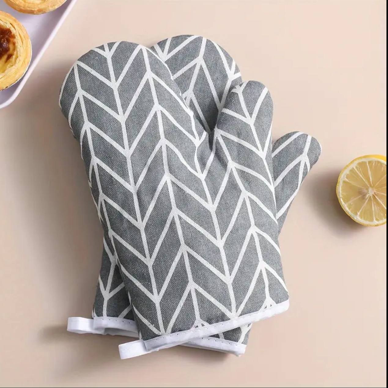 A pair of cotton oven gloves