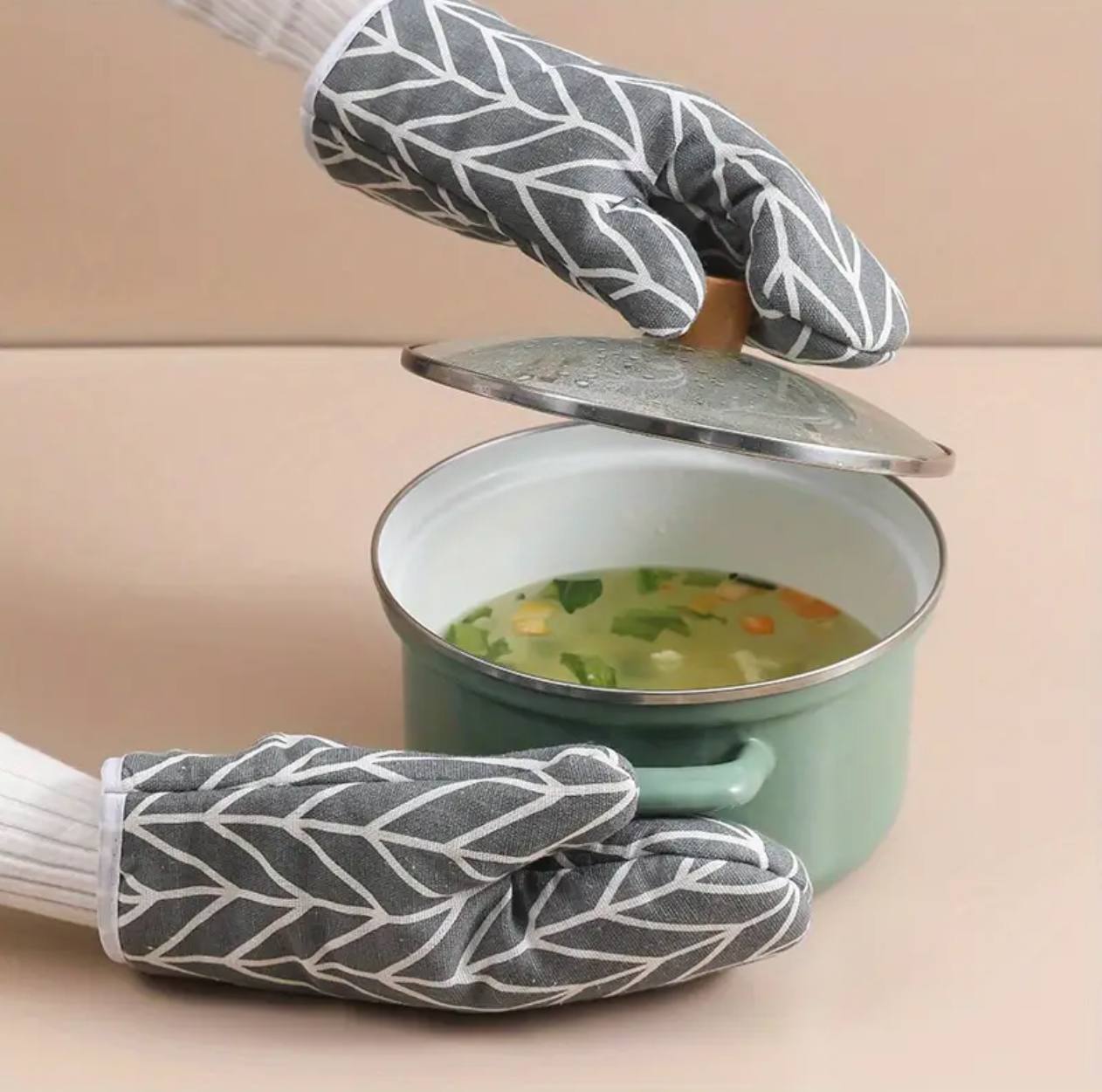 A pair of cotton oven gloves