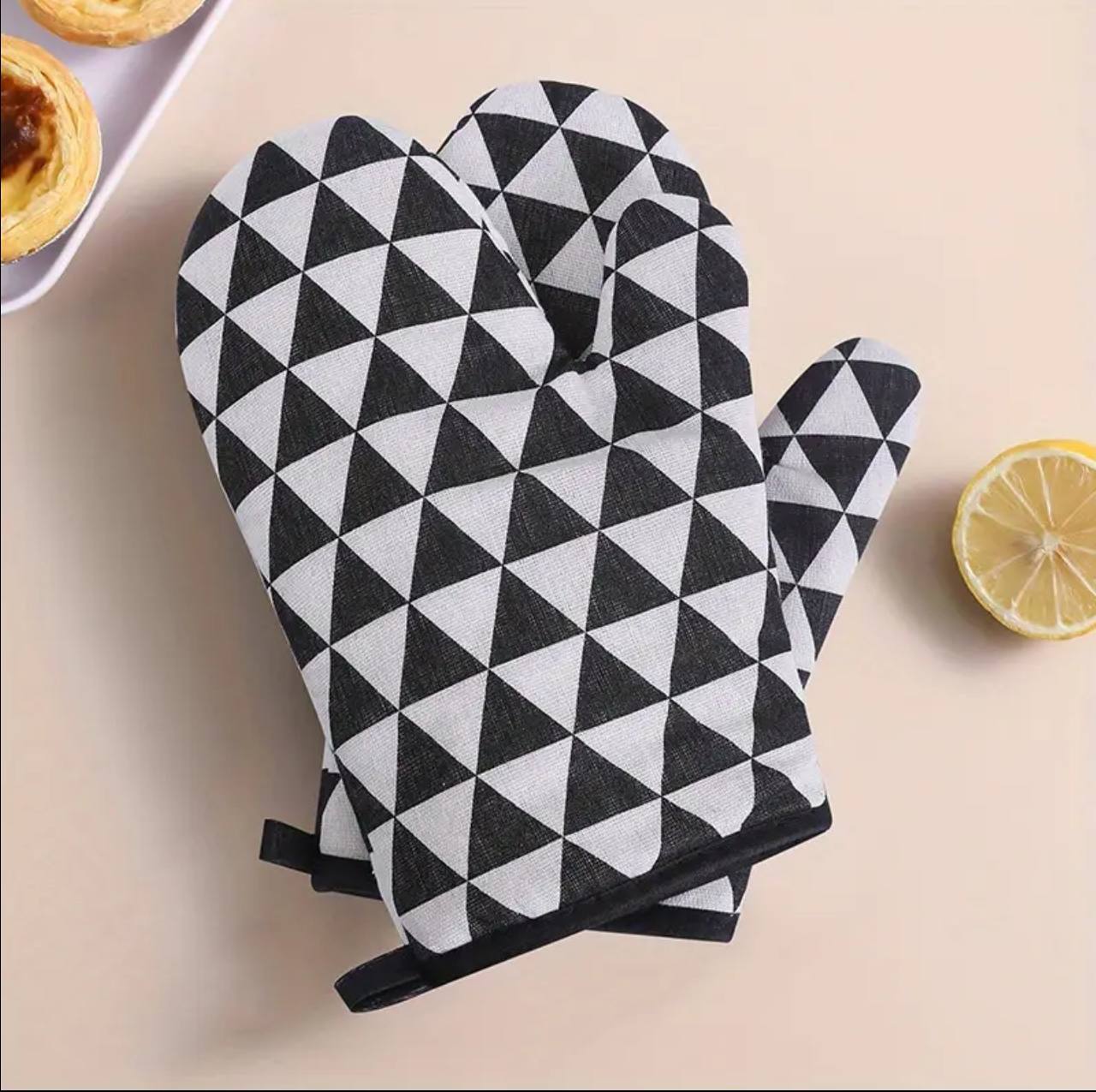 A pair of cotton oven gloves