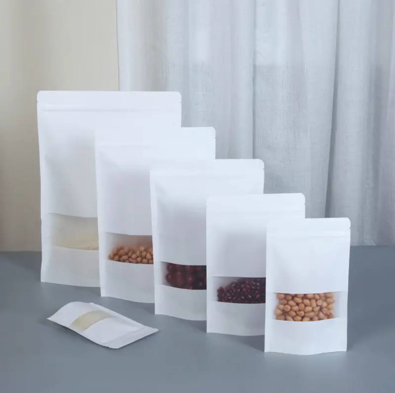 50pcs Stand up pouch with ziplock, window/ matte metallised.