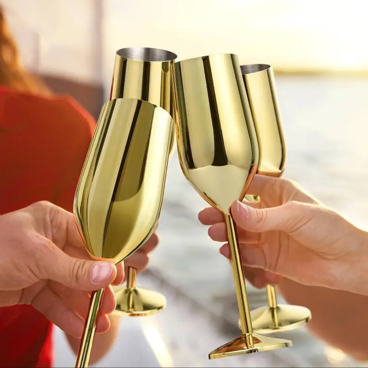 A pair of Gold Stainless steel wine glass